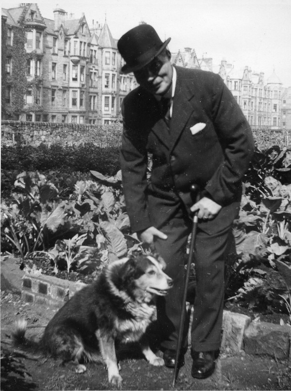 suited man and dog by city allotment