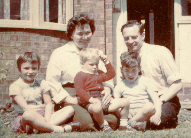 family group sitting on lawn