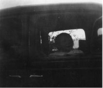 small girl looking out of car window