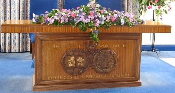 box-like table with carved front
